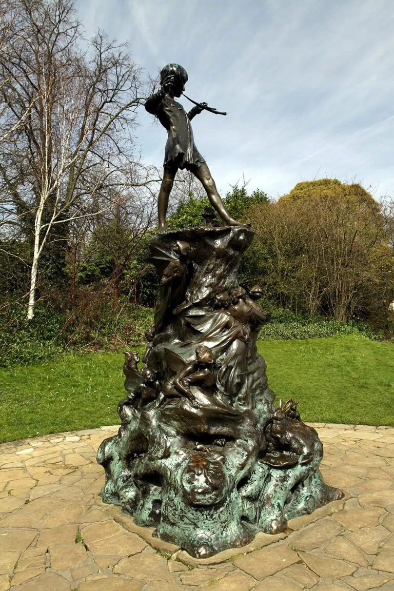 Peter Pan statue in Kensington Gardens, Hyde Park in the City of Westminster in London, Great Britain.